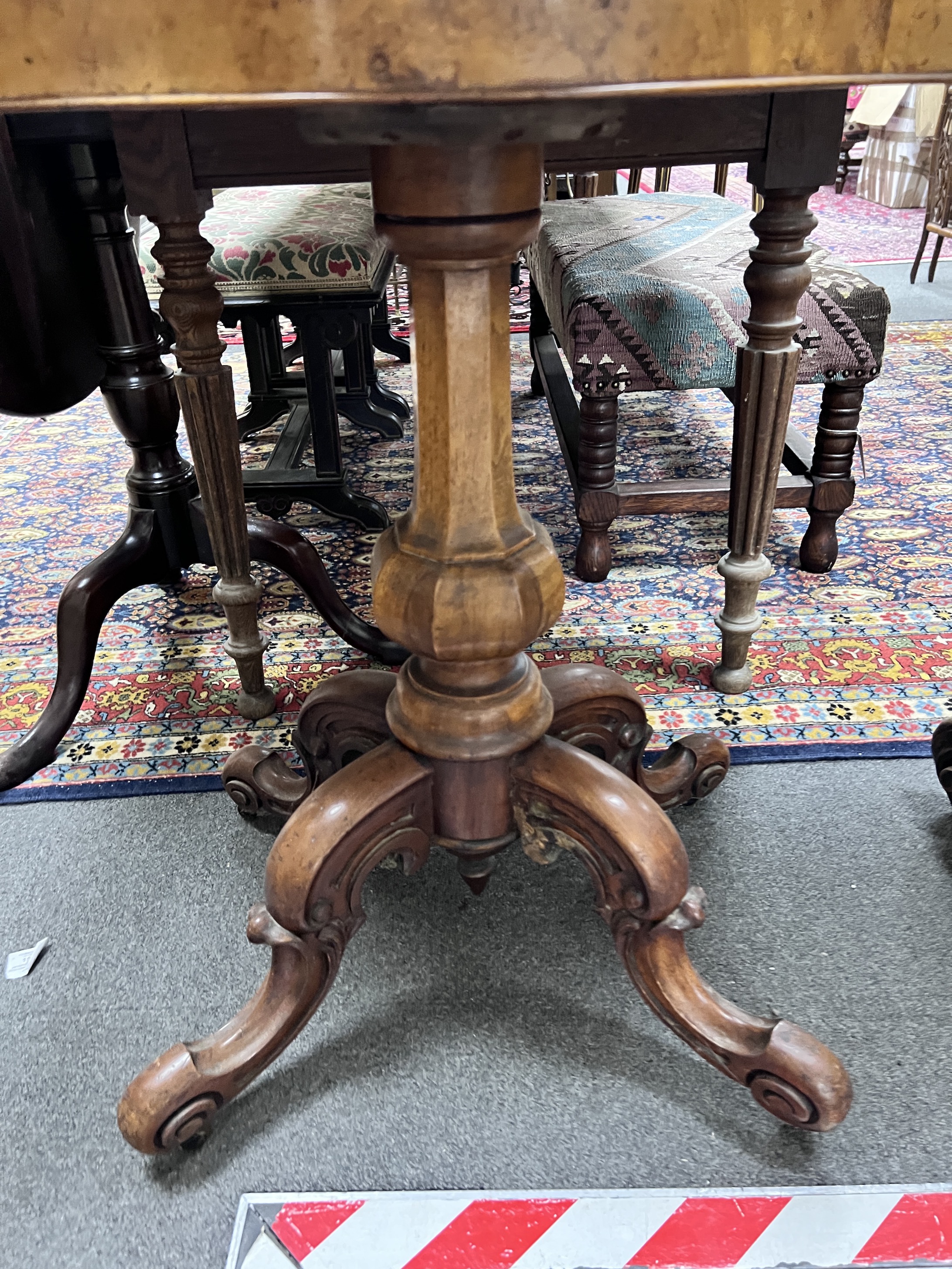 A Victorian walnut demi-lune folding tea table, width 91cm